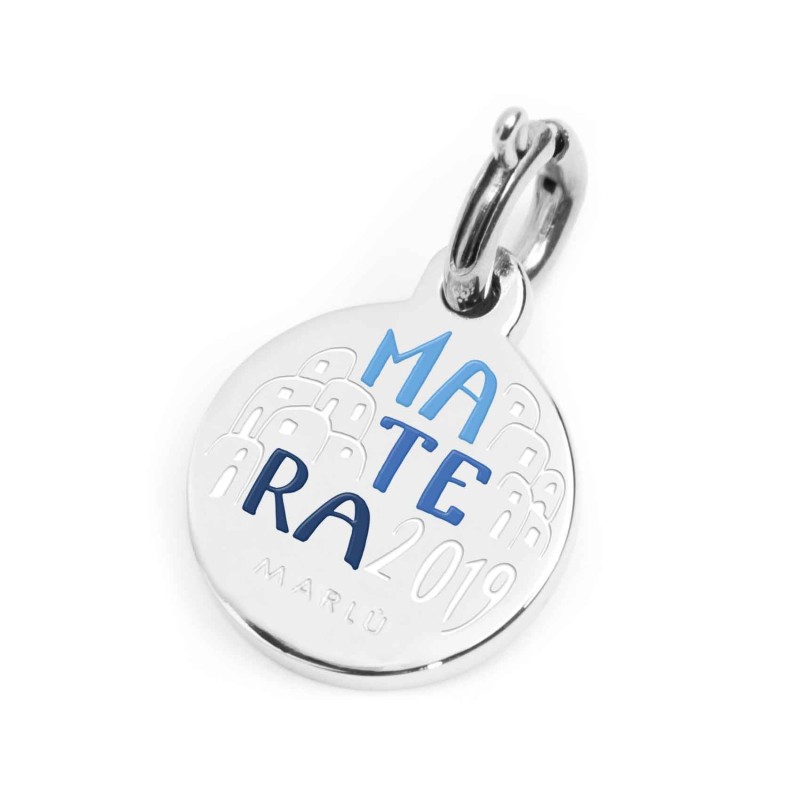 S.STEEL CHARM MATERA 2019 S.steel round charm with Matera 2019 city's symbols image, 14 mm diameter. On the front side lettering