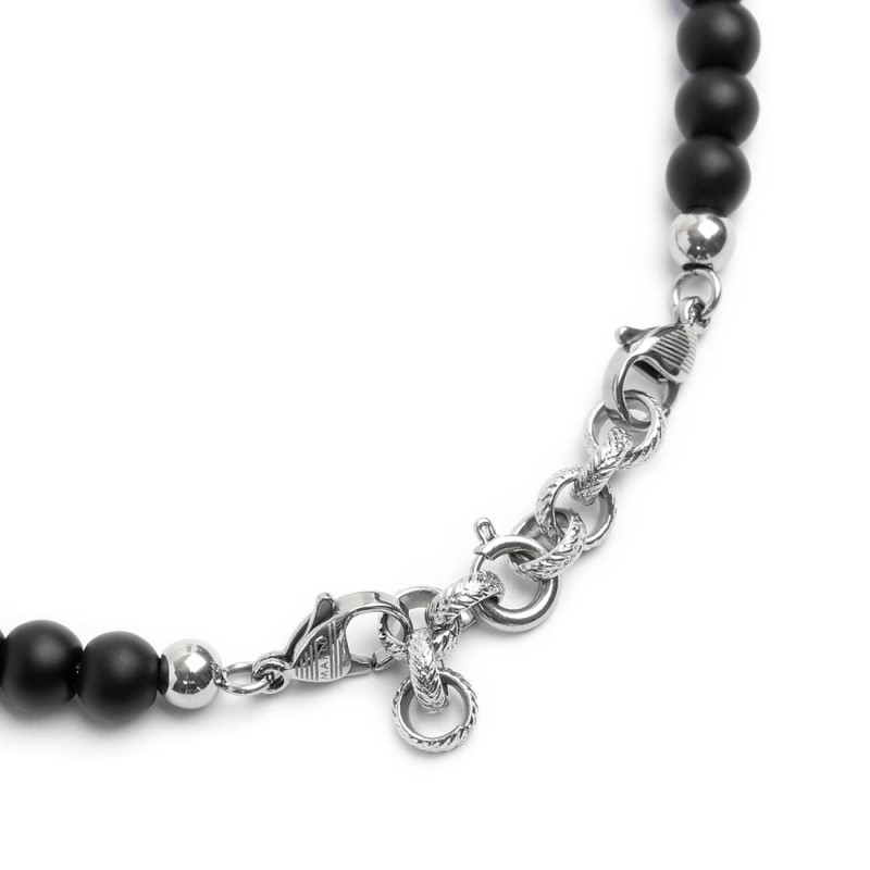 S.STEEL BR BLACK ONYX AND TIGER EYE S.Steel bracelet with on the side black onyx spheres 6,40 mm diameter, 2 elements polished s