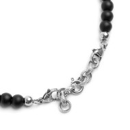 S.STEEL BR BLACK ONYX AND TIGER EYE S.Steel bracelet with on the side black onyx spheres 6,40 mm diameter, 2 elements polished s