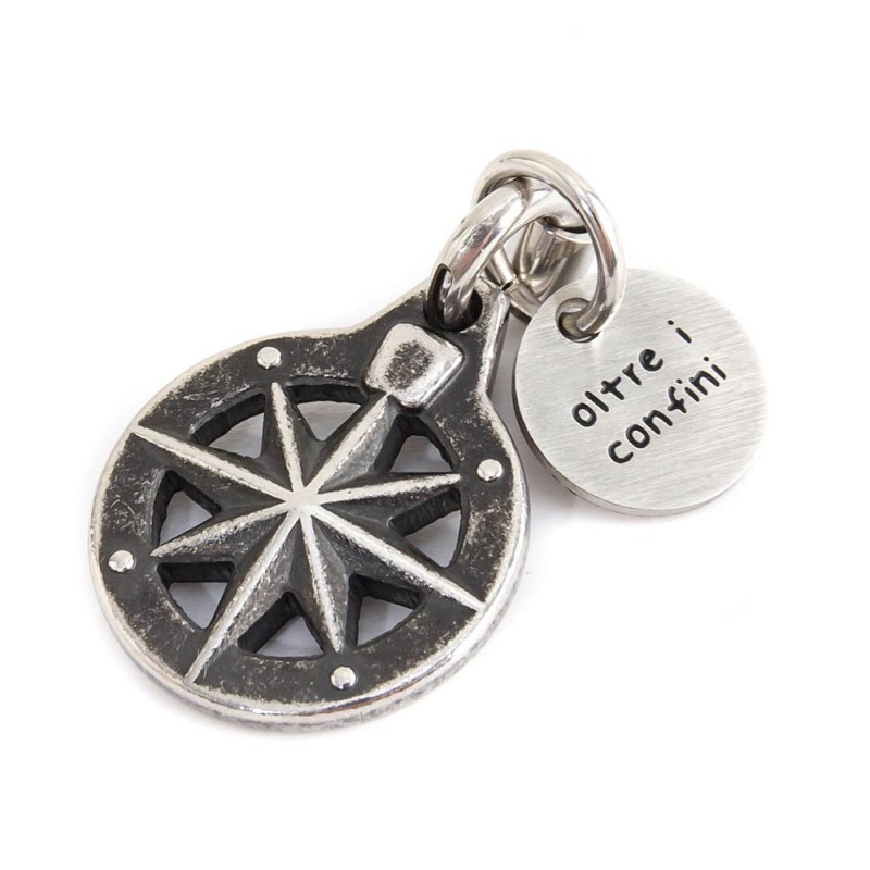 BURNISHED STEEL COMPASS CHARM Burnished steel compass charm 15 X 18.50 mm and round tag with the words "Fortune, success, energy